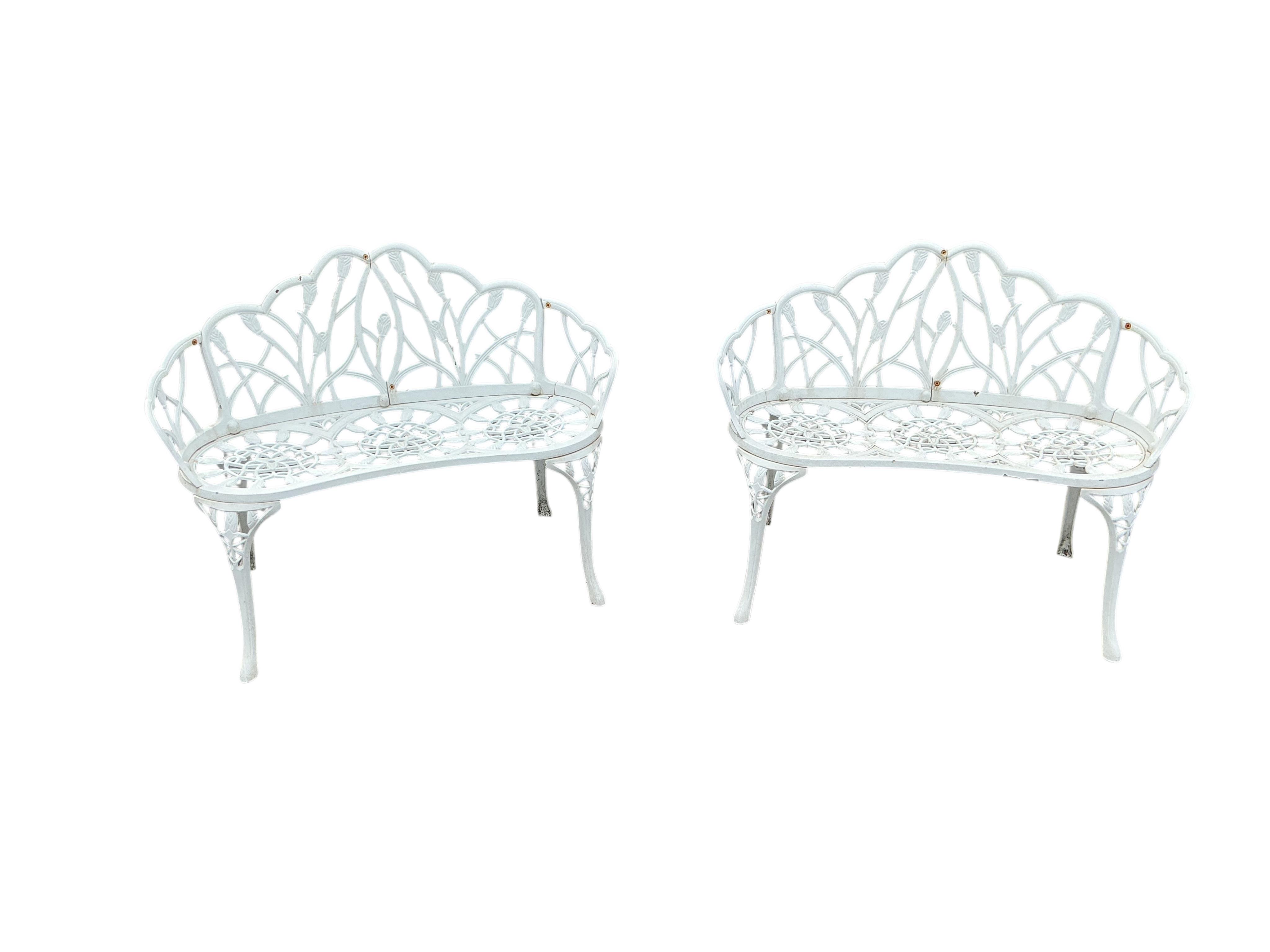 A pair of white painted aluminium garden benches, width 100cm, height 78cm and a similar rectangular glass topped table